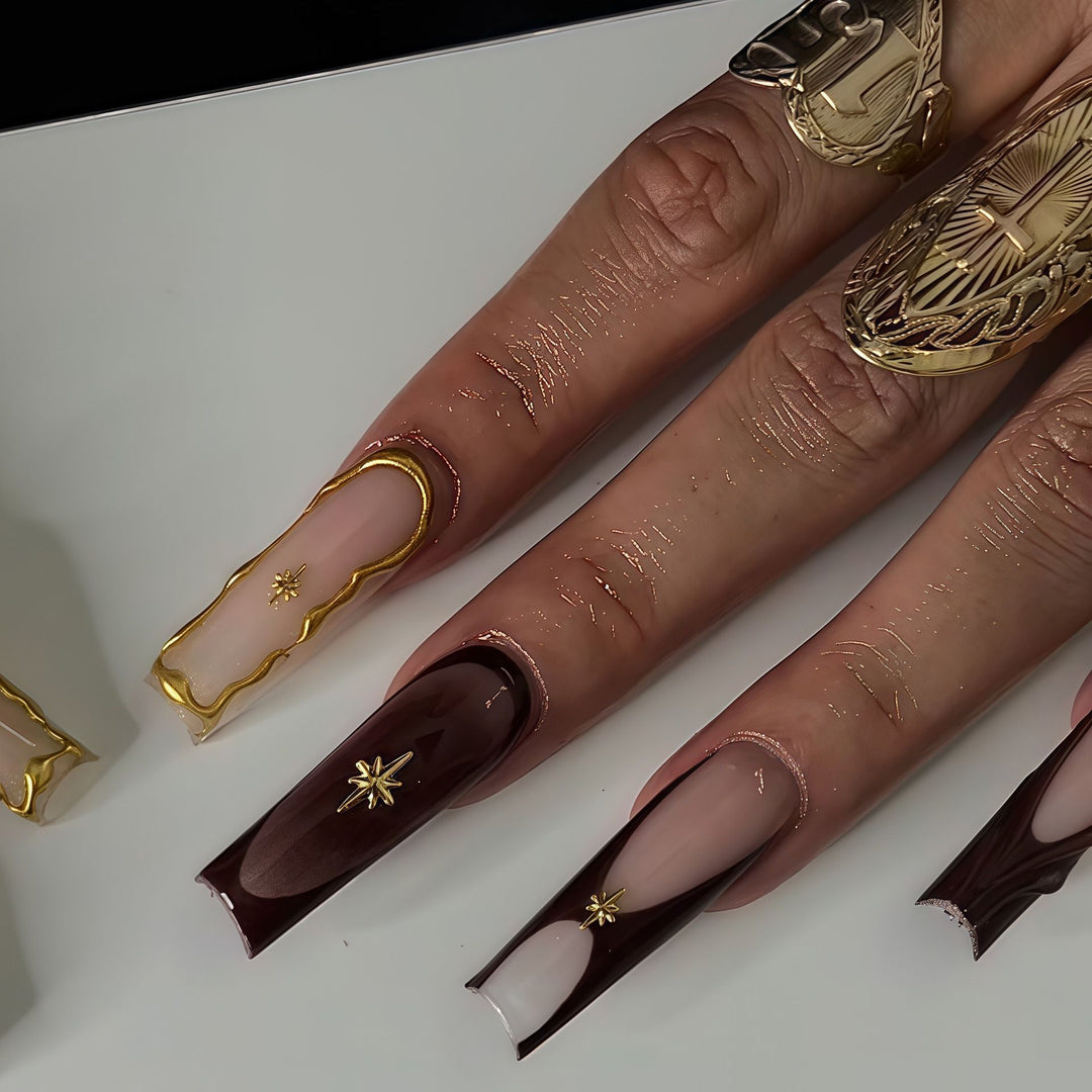 Artistic Sculpted Press-On Nails with Gold Accents Bowlift