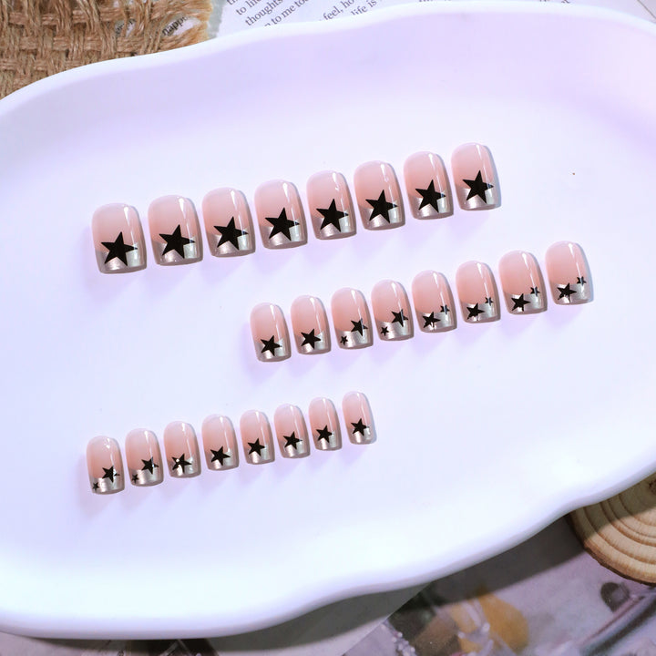 Sparkling nail art with stars and glitter accents Bowlift