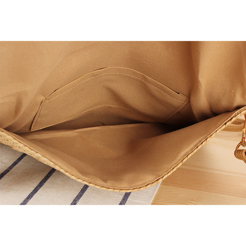 Shoulder bag made of braided natural material with original wave pattern Bowlift