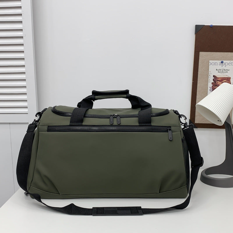 Sporty travel bag with reinforced carrying handles and multiple compartments Bowlift
