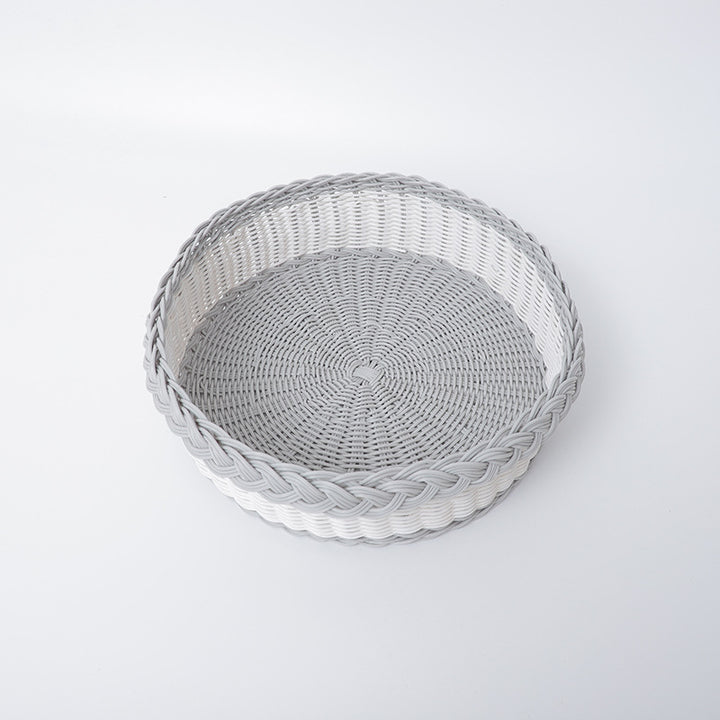 Handwoven storage basket with decorative edge