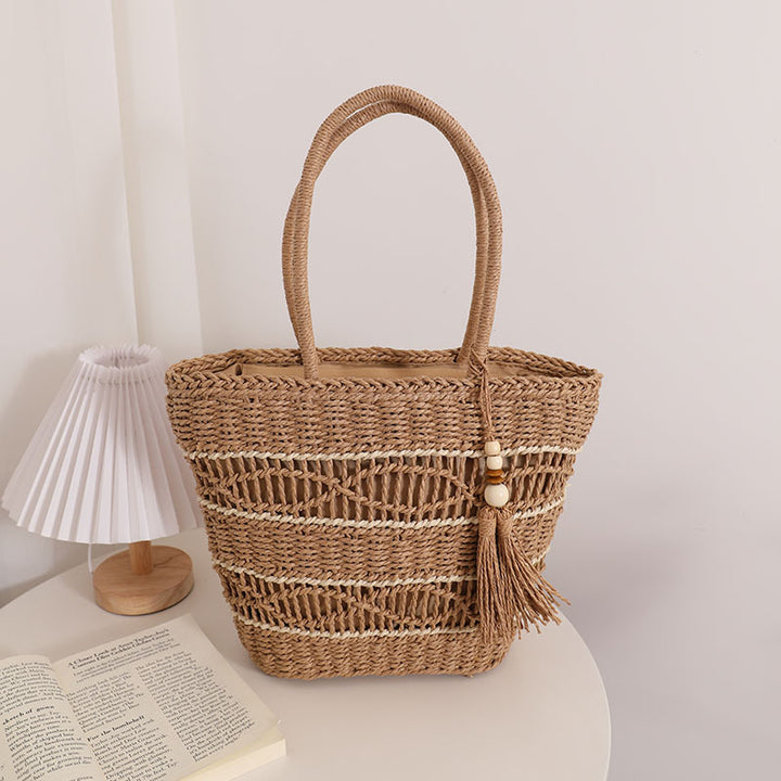 Handcrafted straw tote bag with decorative tassel detail Bowlift