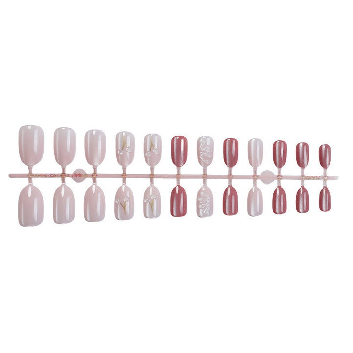 Acrylic nail set with elegant high-gloss finish and creative embellishments Bowlift