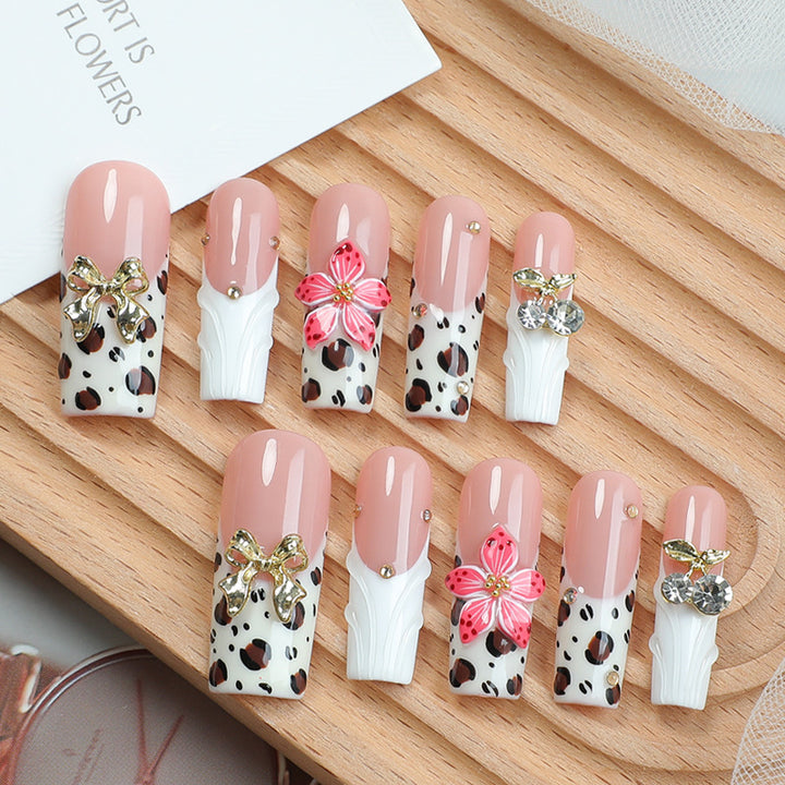 Acrylic nail set with elegant leopard design and floral accents Bowlift