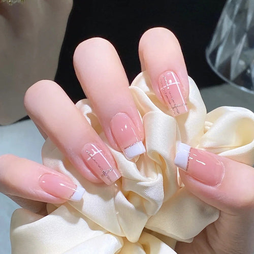 Nail set with elegant French tip and fashionable embellishments Bowlift