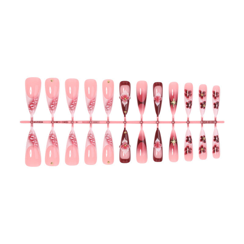 Artifical nail set with delicate floral design and glamorous accents Bowlift