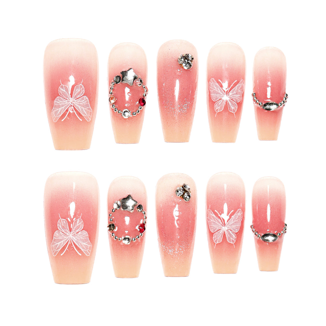 Artificial nail extensions with floral design and sparkling accents Bowlift