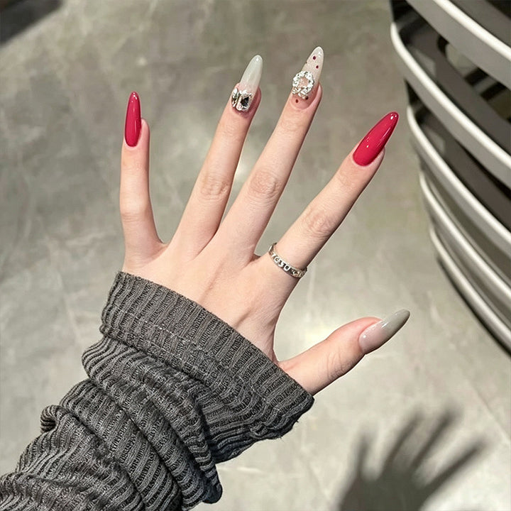 Artificial nail set with sparkling crystal accents and elegant color gradients Bowlift
