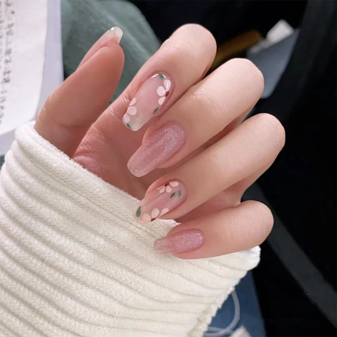Artful Gel Nails with Elegant Floral Design and Glitter Accents Bowlift