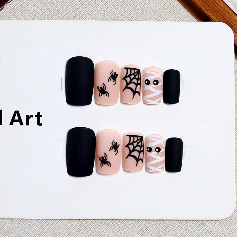 Artificial nail set with creepy Halloween motif and delicate spider designs Bowlift