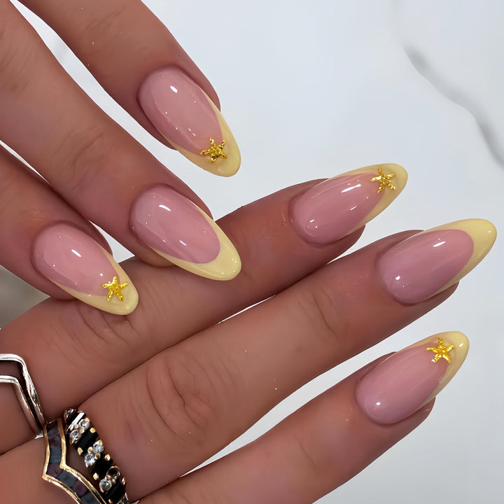 Elegant Stiletto Nail Art Tips with Starfish Accents Bowlift