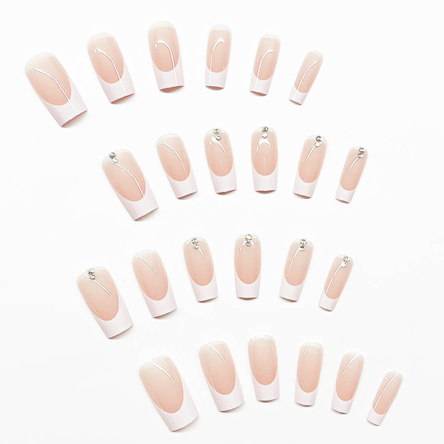 Elegant artificial nail set with high-gloss finish and rhinestone decorations Bowlift