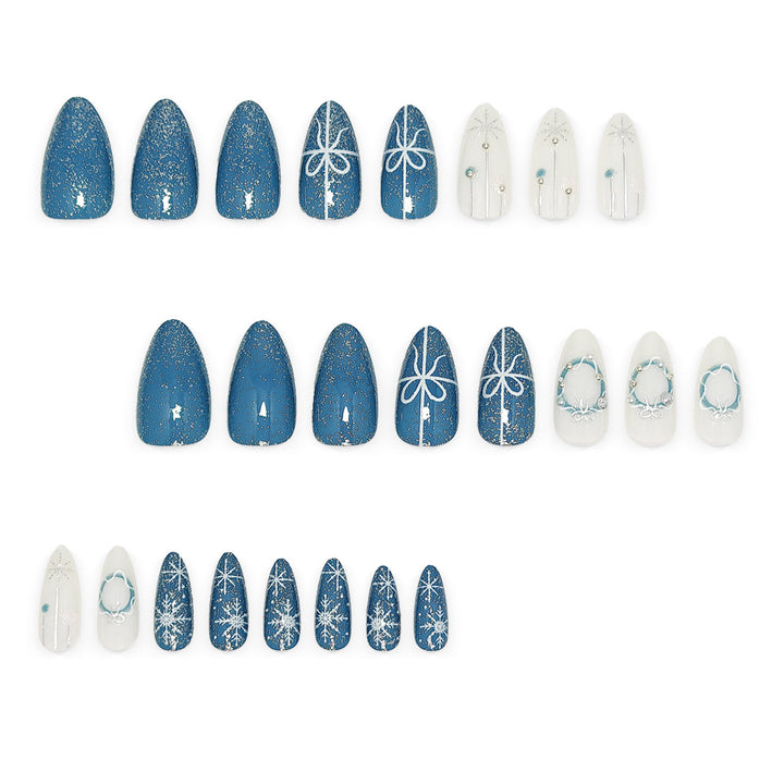 Artificial nails in elegant winter design with glitter accents Bowlift