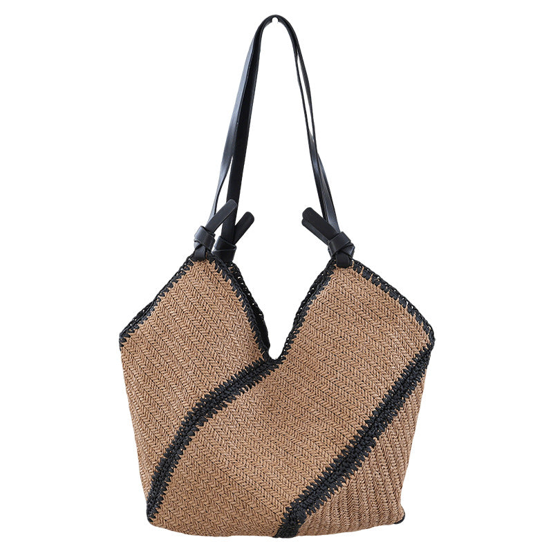 Handbag made of braided natural material with contrasting leather handles Bowlift