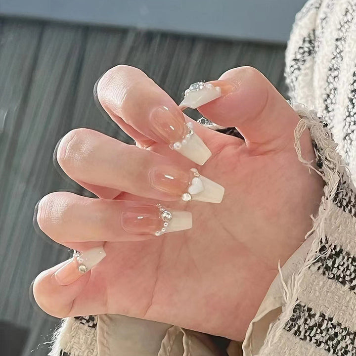 Artificial nails with heart design and glitter accents Bowlift