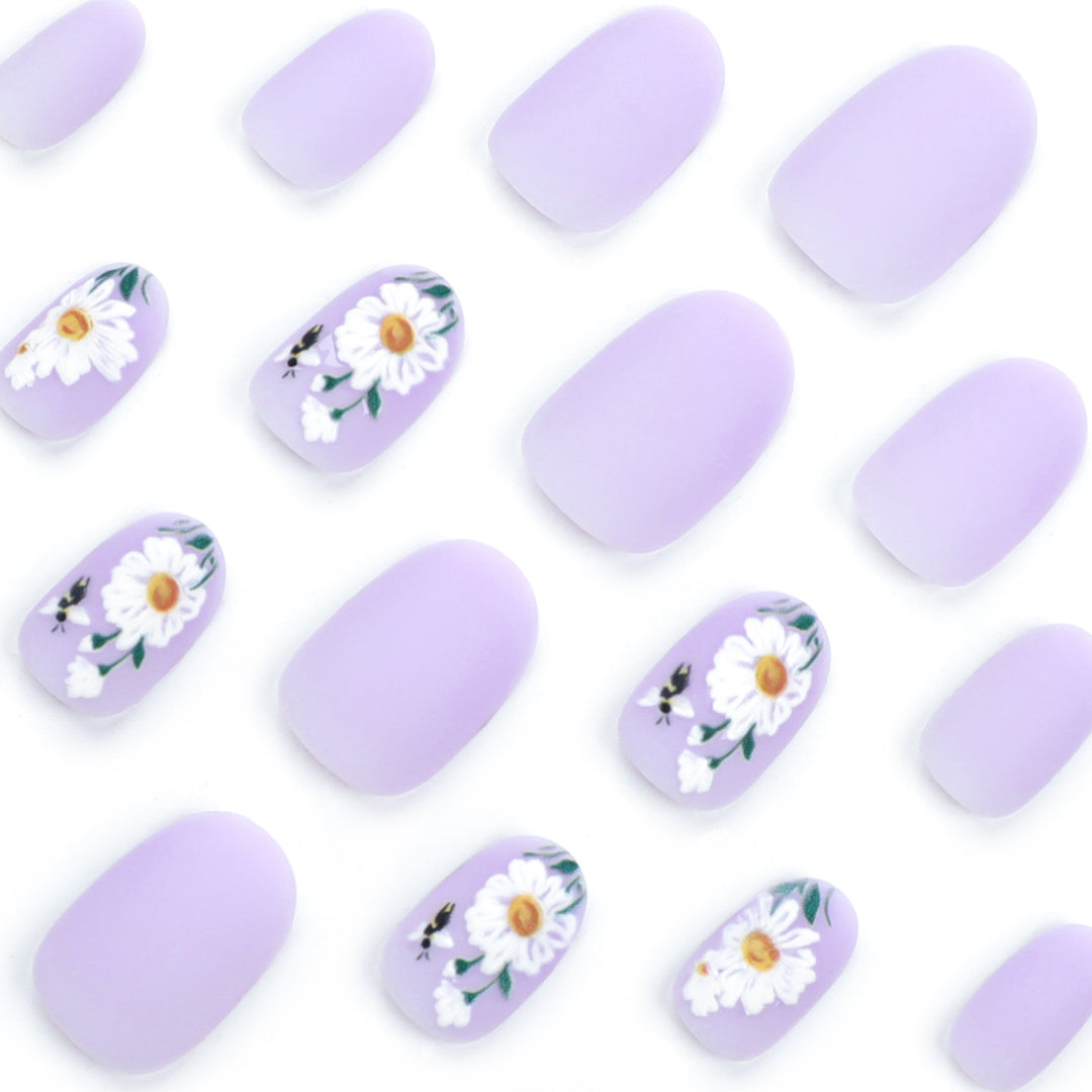 Artistic nail design with delicate floral elements Bowlift