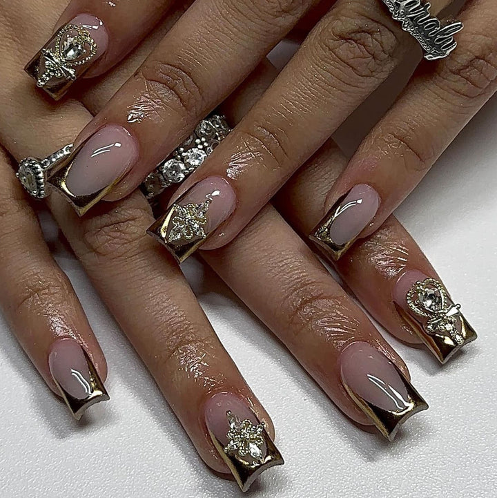 Artful Nail Extensions with Gold Accents Bowlift