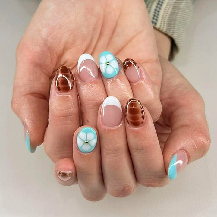 Artificial nail art with floral and geometric elements Bowlift