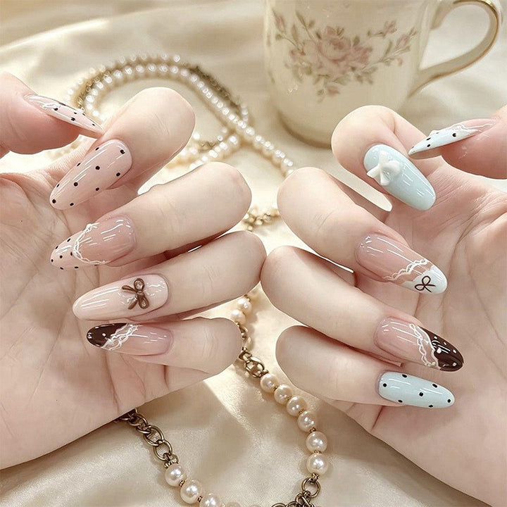 Artificial nail set with elegant accents and fine designs Bowlift