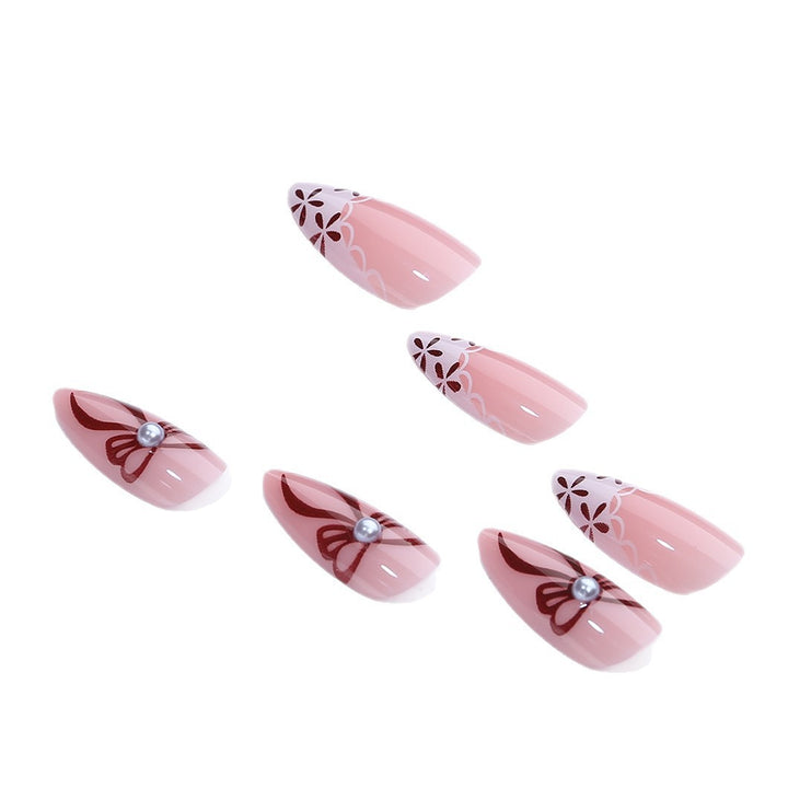 Elegant artificial nail design with floral accents Bowlift