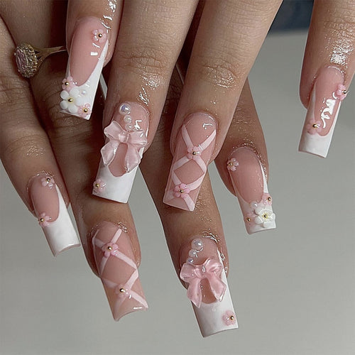 Artificial nail extensions with floral accents Bowlift