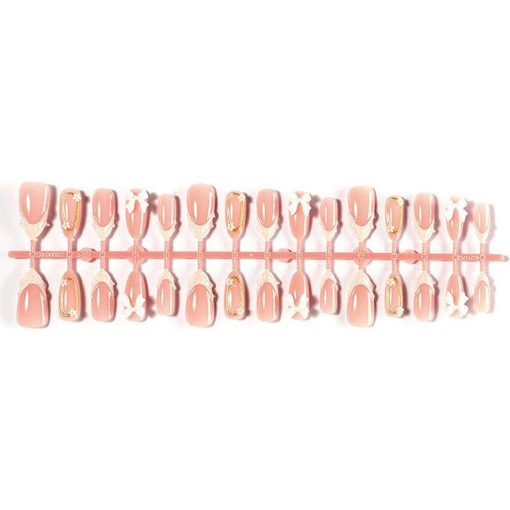 Artificial nail set with playful bow accents and delicate embellishments Bowlift