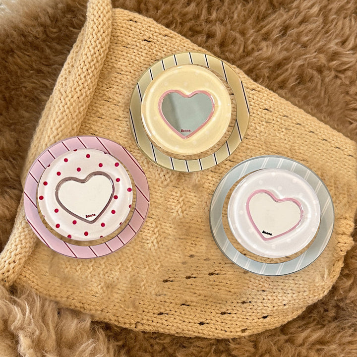 Heart-shaped coaster with playful design Bowlift