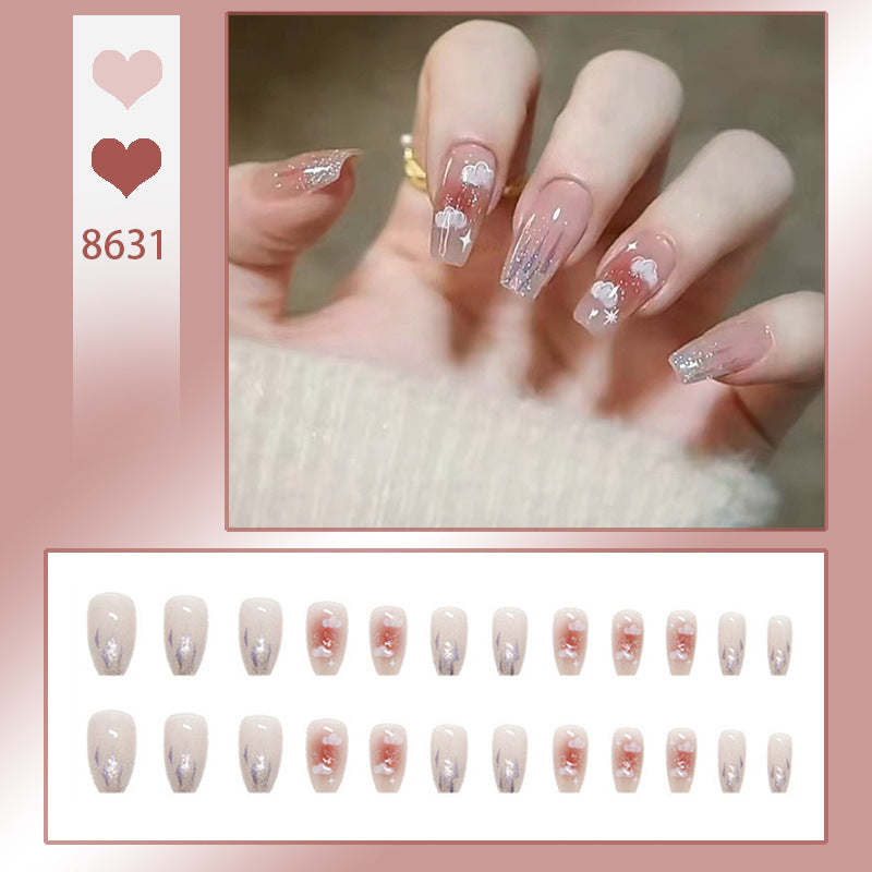 Artificial nail set with floral design and glitter accents Bowlift