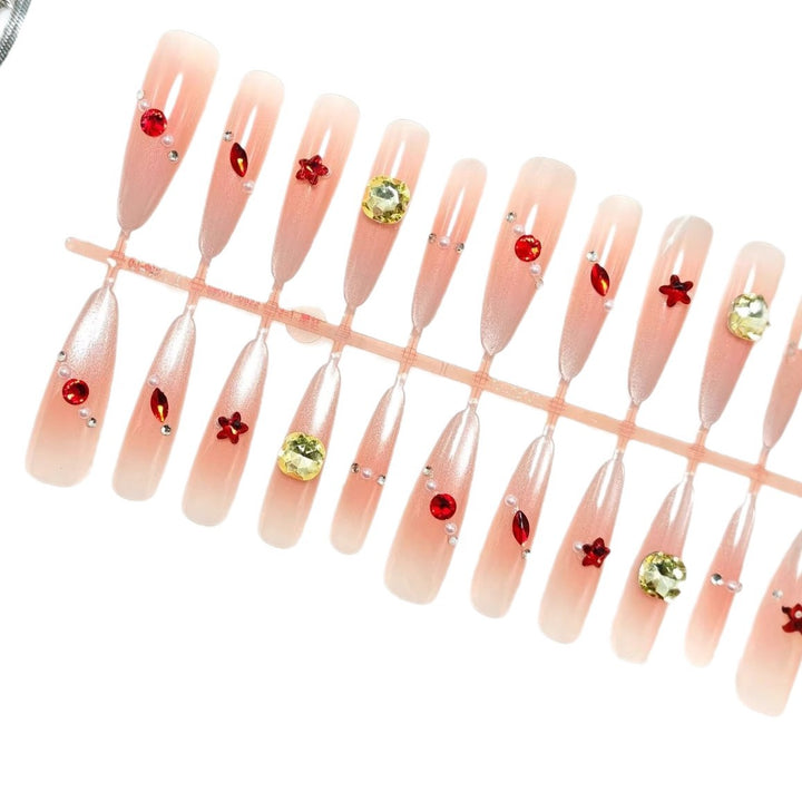 Glamorous artificial nails with shimmering embellishments Bowlift