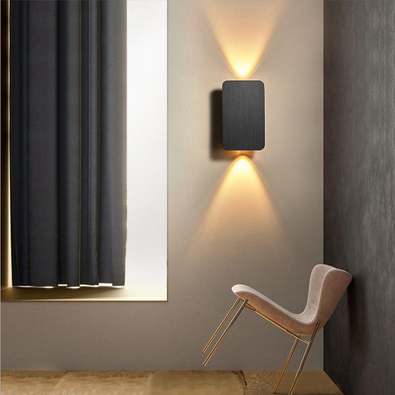 Modern rectangular LED wall sconce with dual up down beam and slim low-profile housing Bowlift
