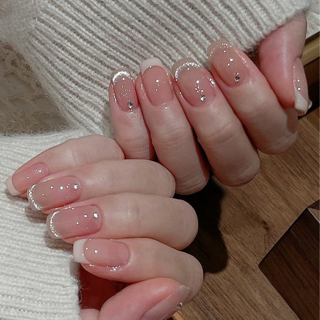 Glamorous artificial nails with filigree rhinestone details Bowlift