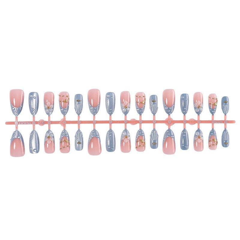 Creative acrylic nail set with elegant flower and glitter accents Bowlift
