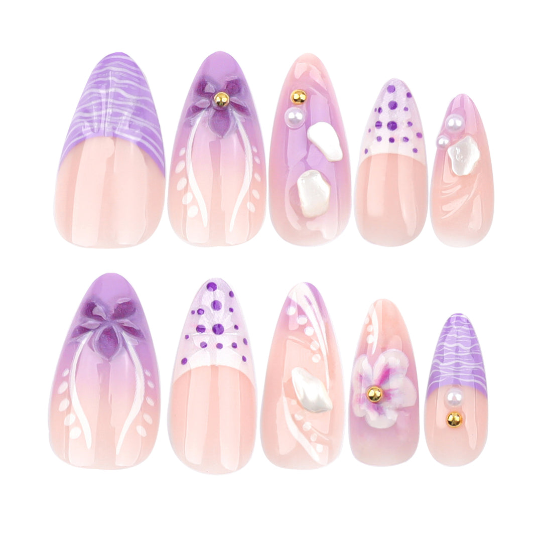 Artful nail extensions with elegant floral embellishments Bowlift