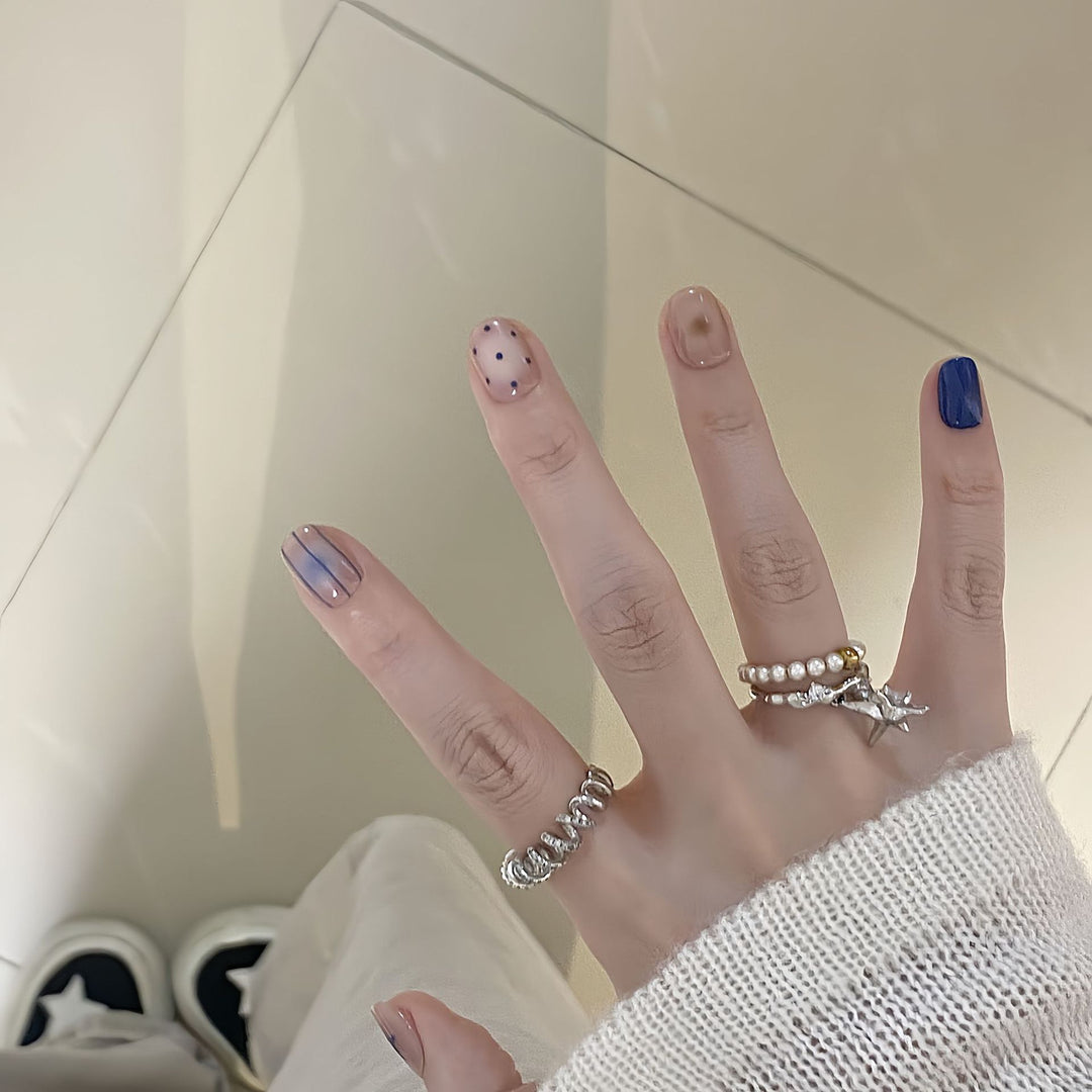 Artificial nails in modern design with geometric and sparkling accents Bowlift