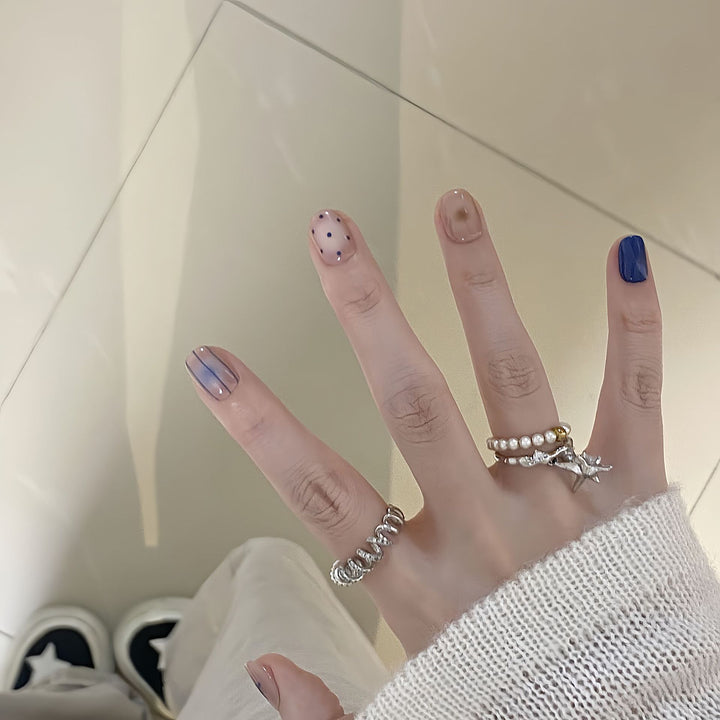 Artificial nails in modern design with geometric and sparkling accents Bowlift