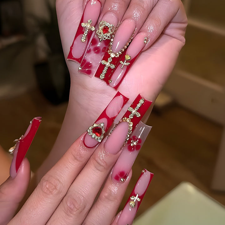 Glamorous Stiletto Press-On Nails with Artistic Gold and Red Accents Bowlift