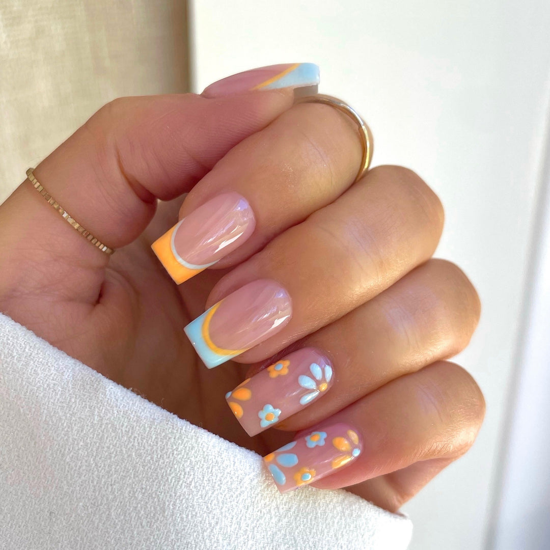 Nail art set with creative floral designs and elegant French finish Bowlift
