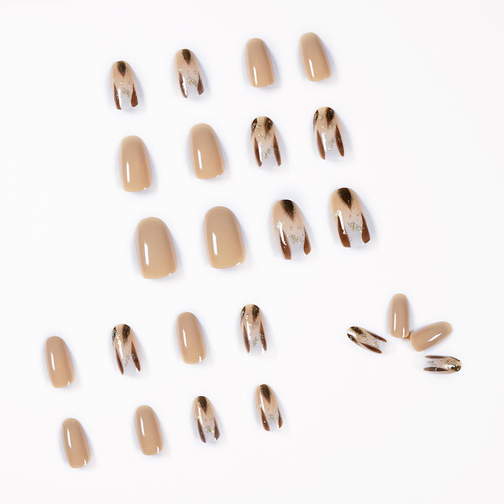 Artificial nail extensions with modern design and glitter accents Bowlift