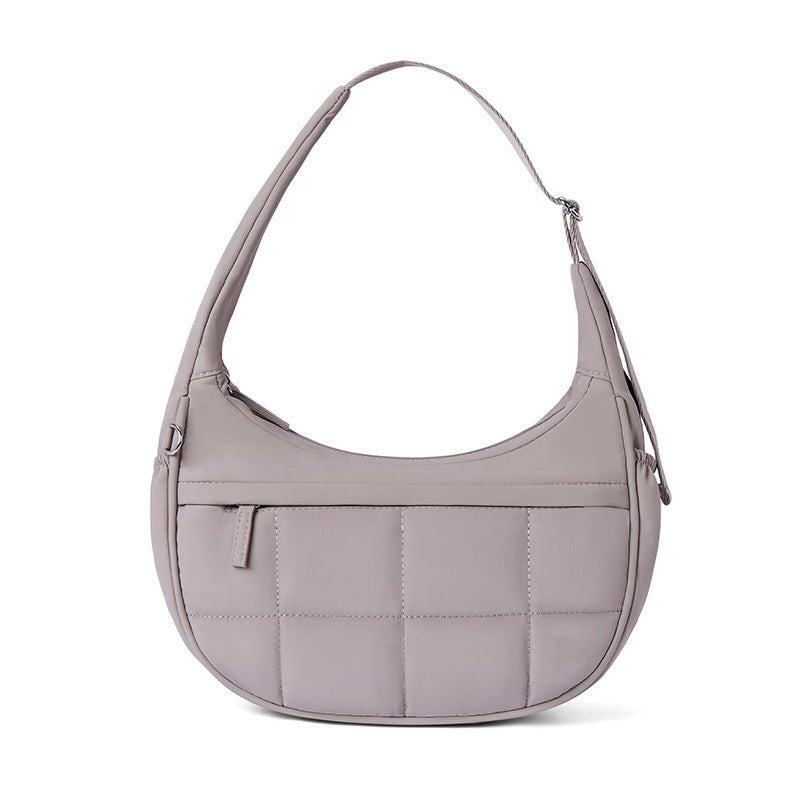 Fashionable shoulder bag with quilted surface Bowlift