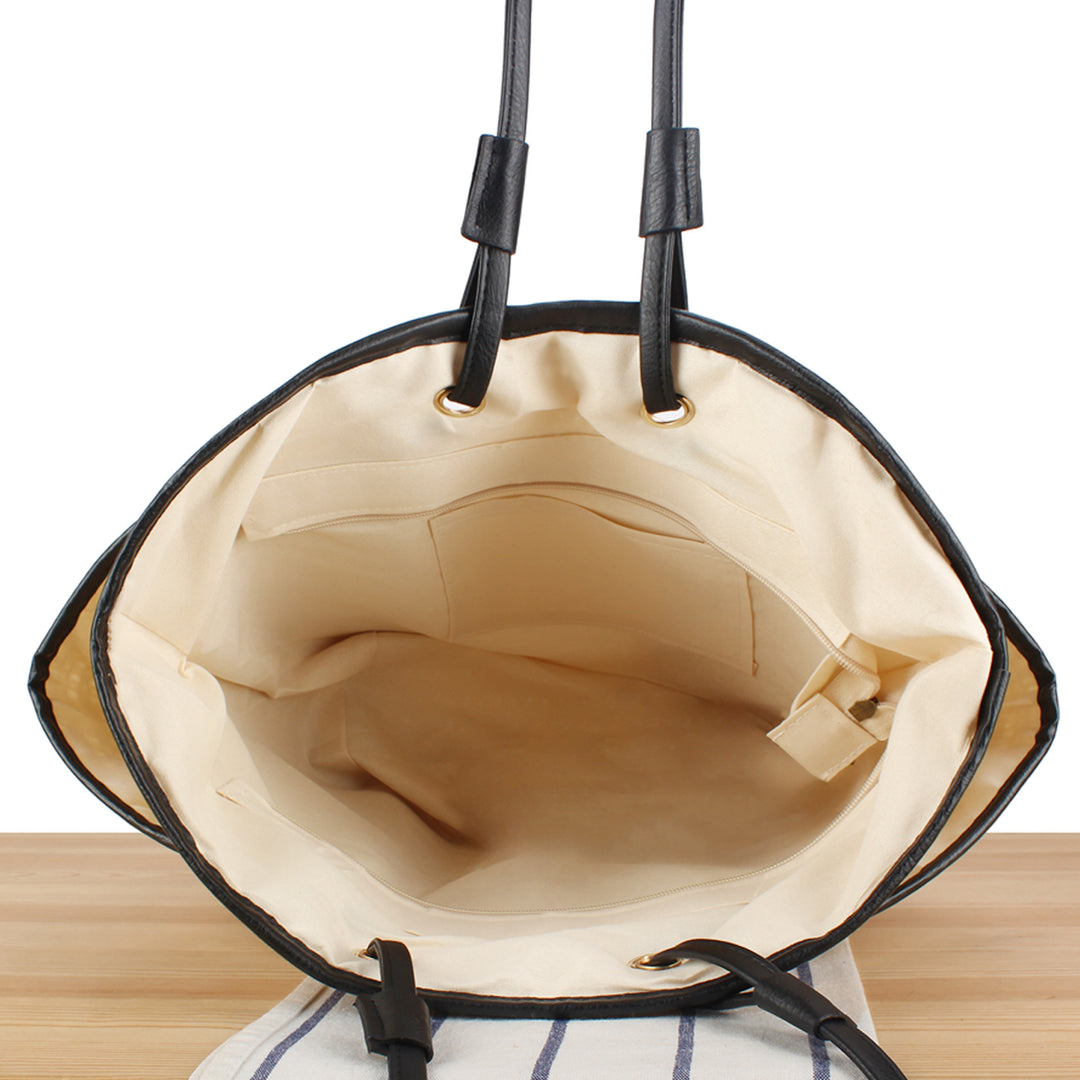 Tote bag with sophisticated compartment design and durable leather handles Bowlift
