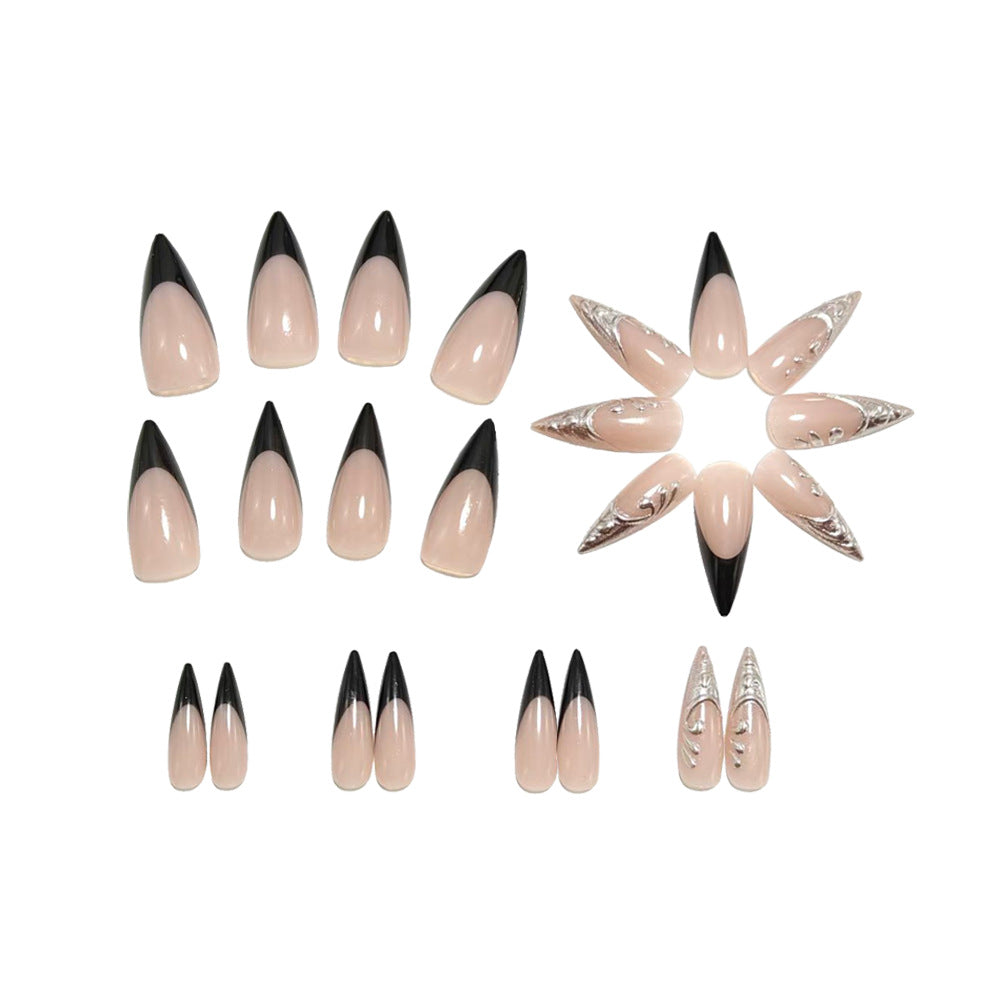 Artificial nails in elegant stiletto style with elaborate metal decoration Bowlift
