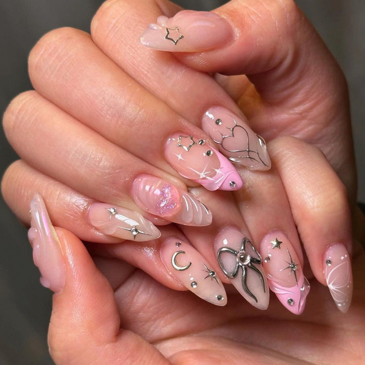 Artful nail art with filigree designs and glitter accents Bowlift
