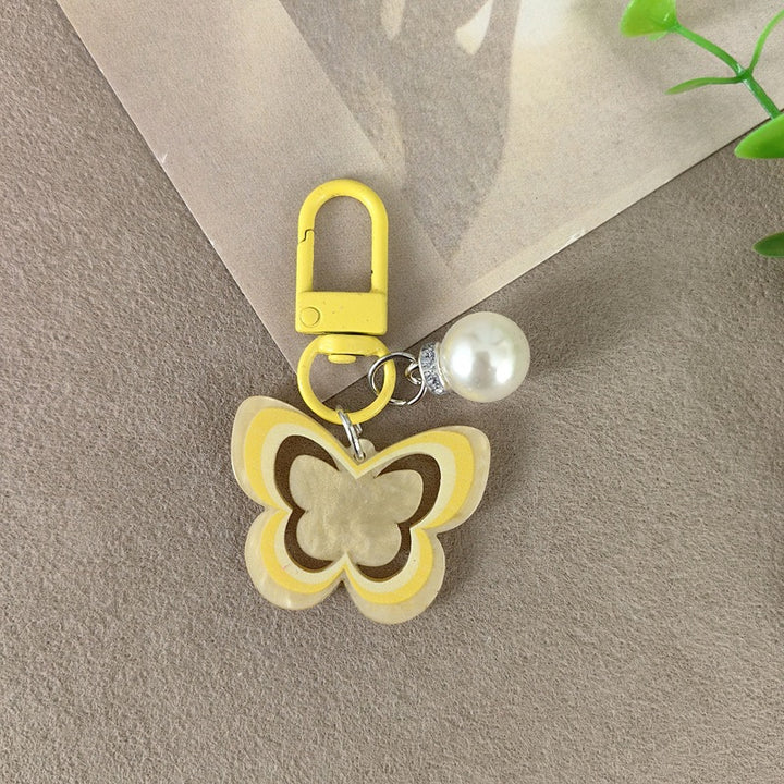 Keychain with butterfly and pearl accent Bowlift