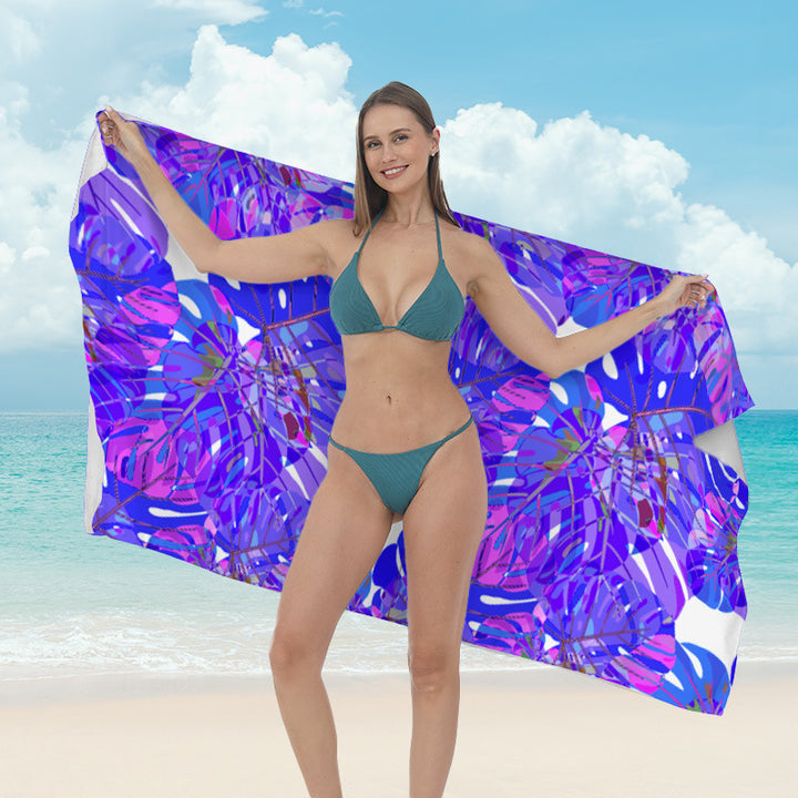Beach towel with vibrant tropical plant motif Bowlift