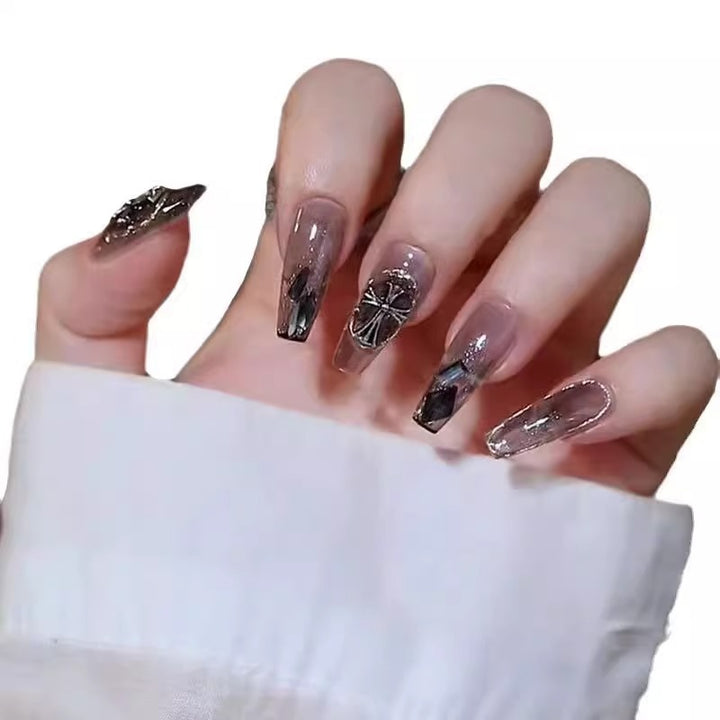 Glamorous artificial nails with heart design and glittering accents Bowlift