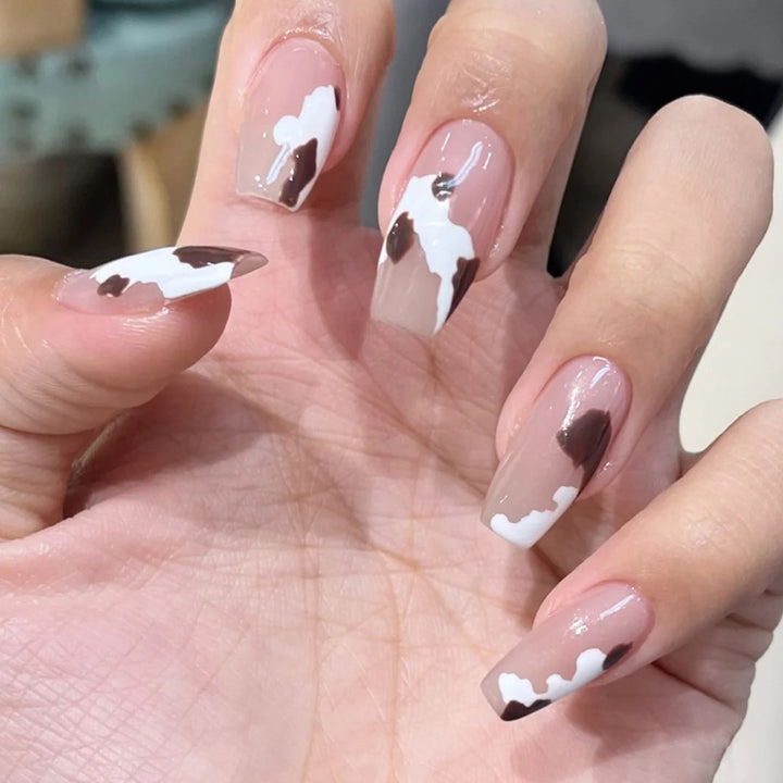 Artistic acrylic nails with elegant gradient and creative designs Bowlift