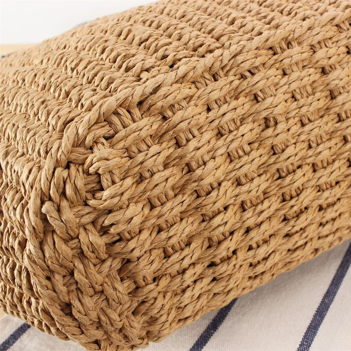 Beach bag made of handwoven natural material with sturdy leather straps Bowlift