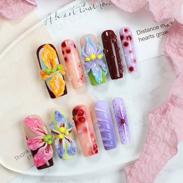 Creative artificial nail set with elegant floral design and glitter accents Bowlift