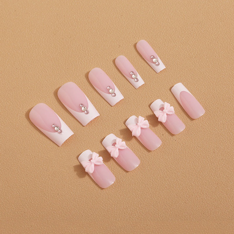 Trendy French-design artificial nails with bow accents Bowlift