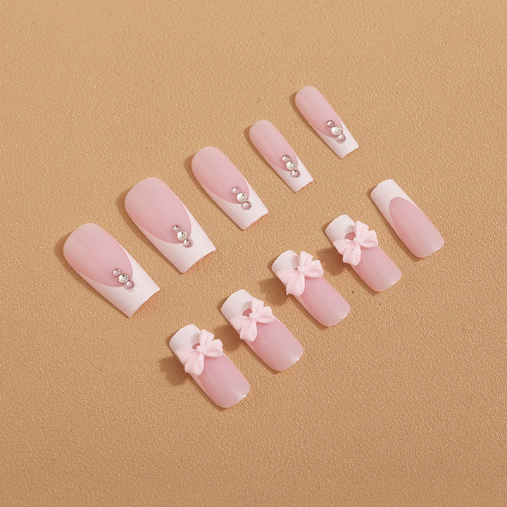 Trendy French-design artificial nails with bow accents Bowlift
